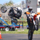 Image shows rider learning to wheelie at superbike-coach cornering class